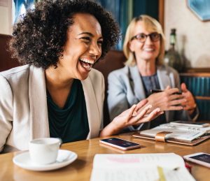 Professional lady in meeting, laughing